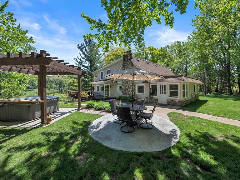 Wooded riverfront setting in Big Rapids